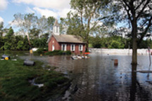 Danforth Chapel on the grounds of the University of Iowa is surrounded by floodwaters from the Iowa River/Photo by Greg Henshall/FEMA